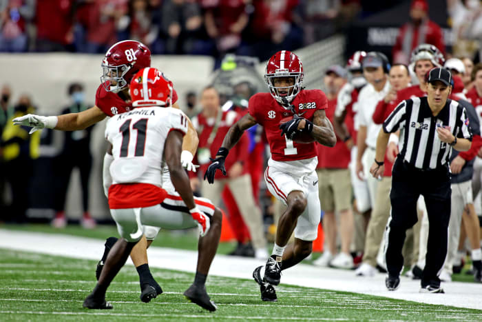 Jan 10, 2022; Indianapolis, IN, USA; Alabama Crimson Tide wide receiver Jameson Williams (1) runs the ball against Georgia Bulldogs defensive back Derion Kendrick (11) during the first quarter in the 2022 CFP college football national championship game at Lucas Oil Stadium. Mandatory Credit: Trevor Ruszkowski-USA TODAY Sports